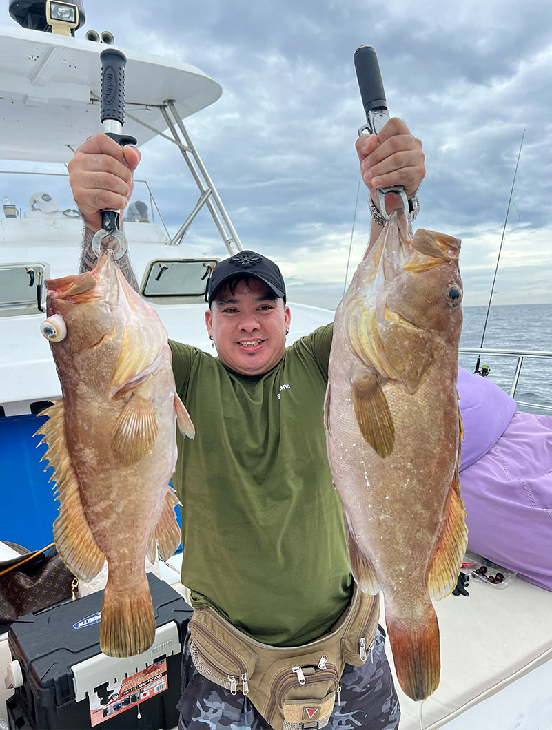 Angler presenting two catches