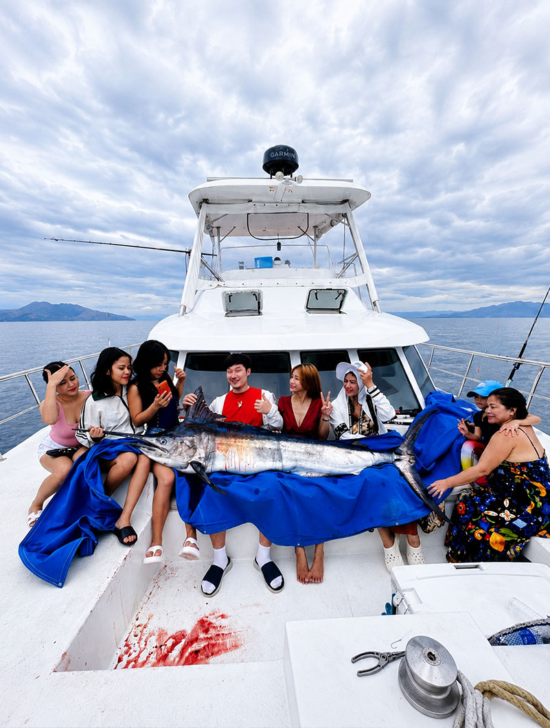 Guests fishing together aboard a charter boat